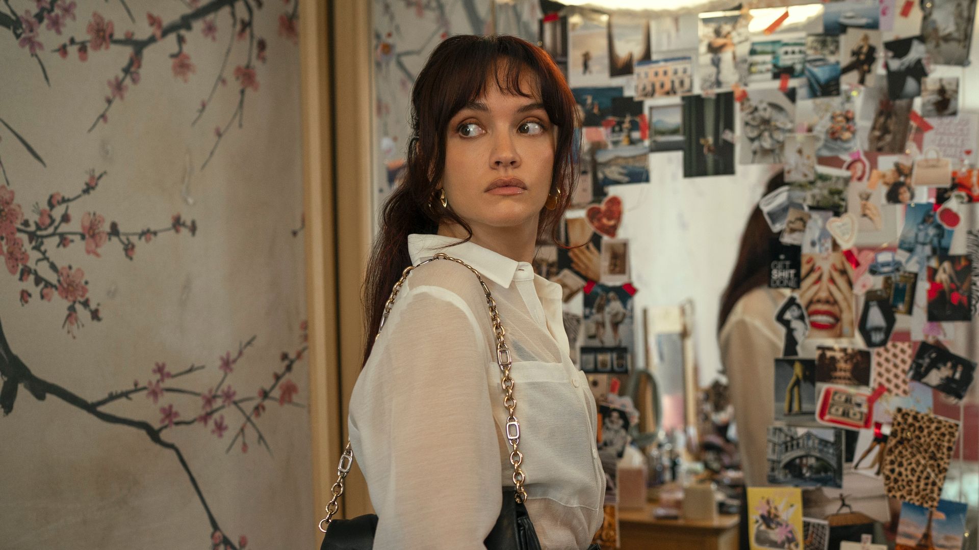 brunette woman standing in front of mirror    