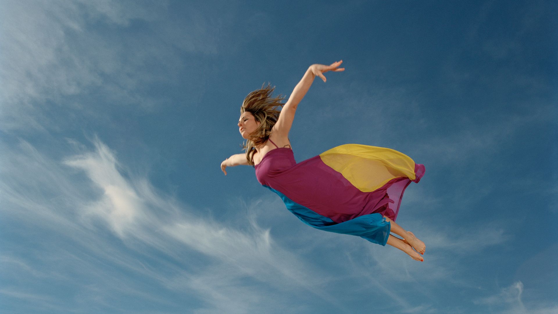 A woman flying through the sky 