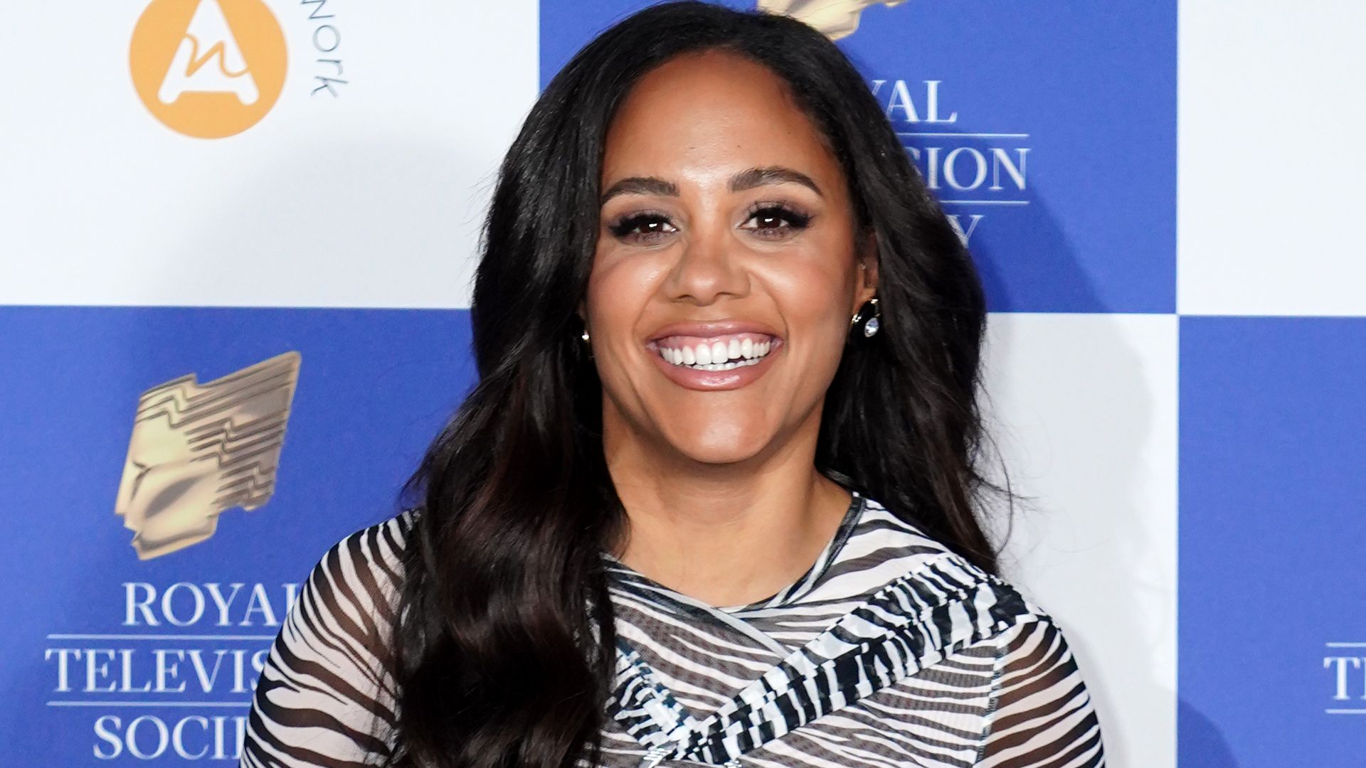 Alex Scott turns up the heat in sleeveless top and suit combo for smouldering pictures