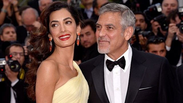 George Clooney and his wife Amal Clooney attend the "Money Monster" premiere during the 69th annual Cannes Film Festival at the Palais des Festivals on May 12, 2016 in Cannes, France.