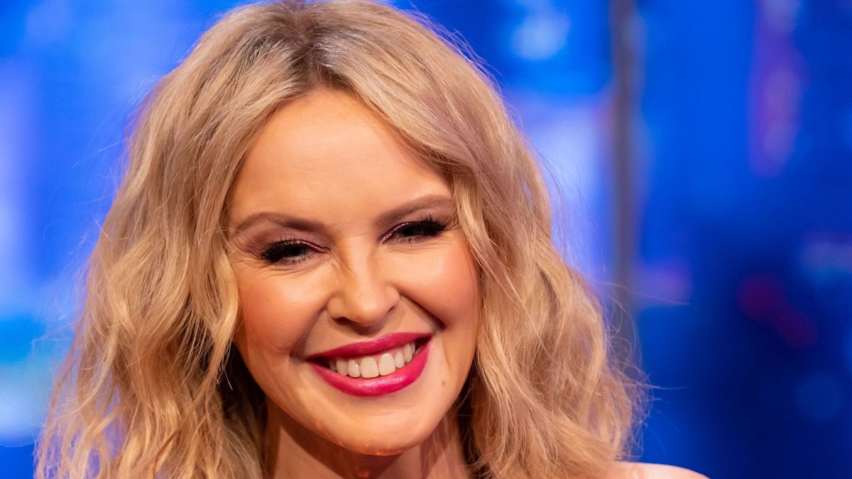 Kylie Minogue blows fans away with sky-high legs in daring mini dress ...