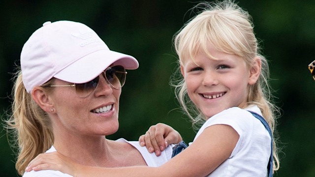 Isla Phillips is carried by her mother Autumn Phillips