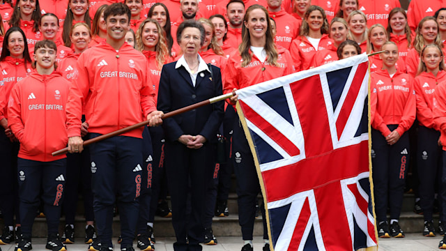 The Princess Royal stands between Team GB Flagbearers Helen Glover and Tom Daley, and other team members