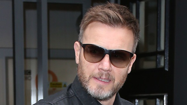 Gary Barlow wearing tinted sunglasses