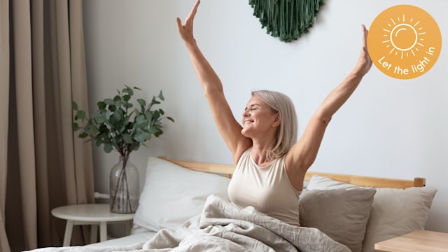 Woman stretching in bed