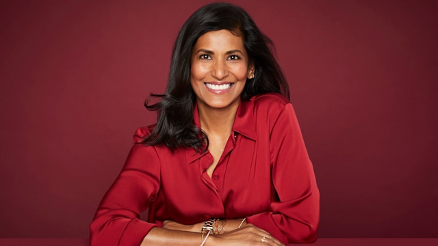 smiling lady in red shirt