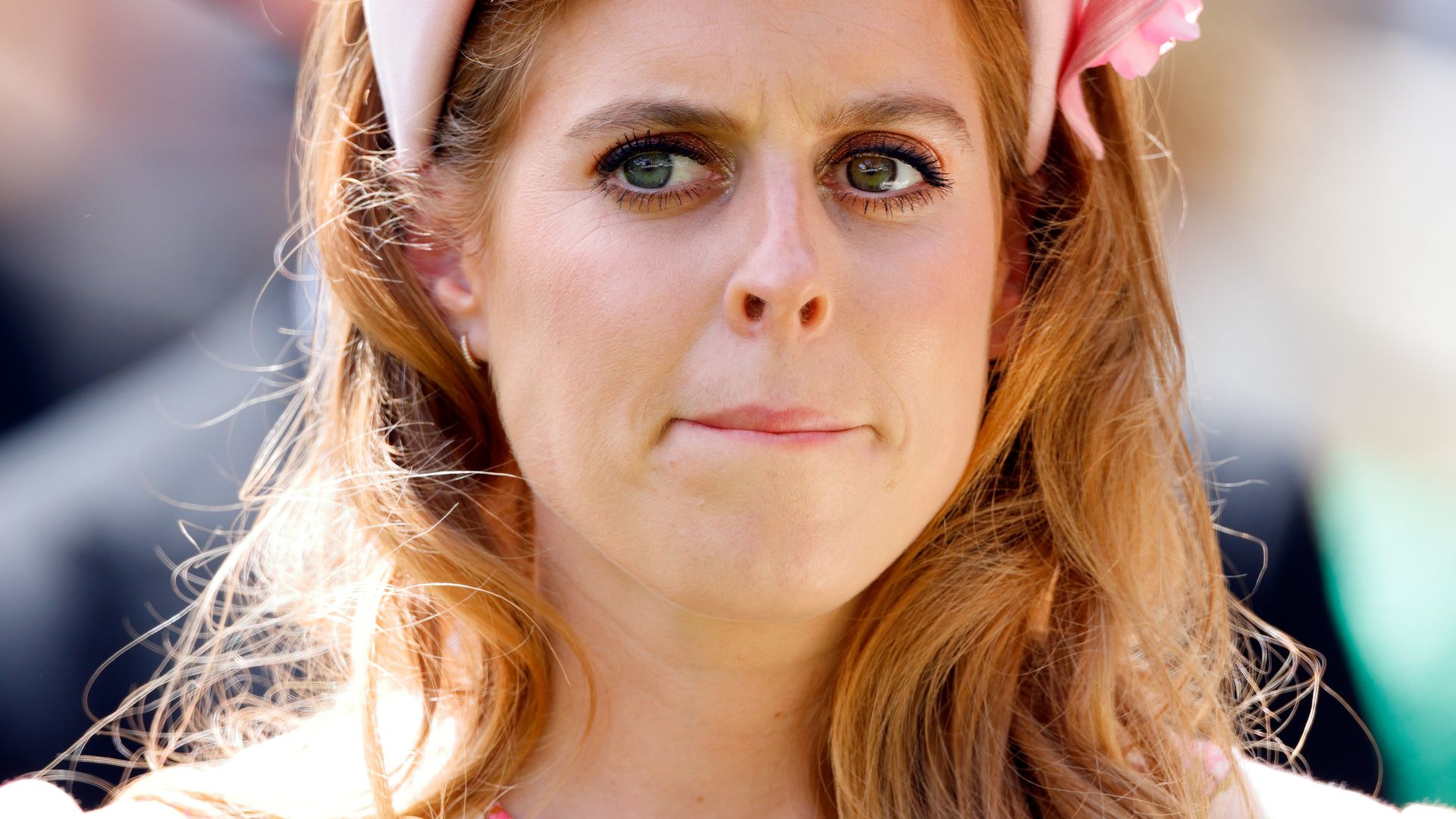 red headed lady in floral hat and pink dress