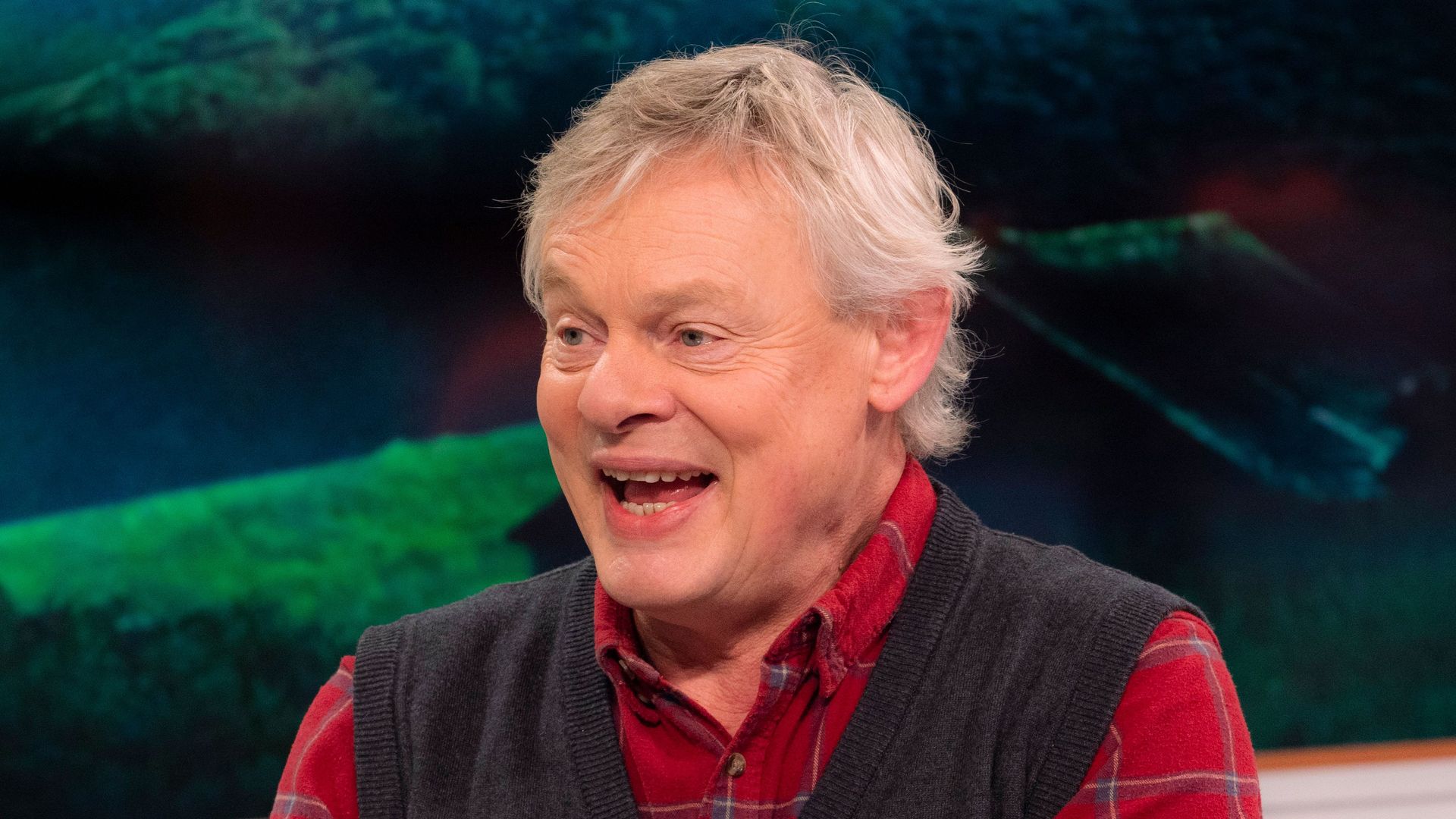 Martin Clunes a plaid shirt and waistcoat