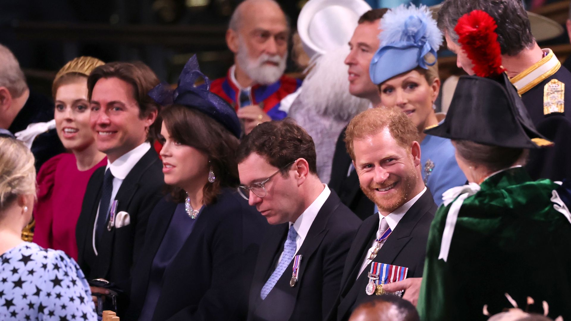 Prince Harry beaming at Princess Anne at the coronation