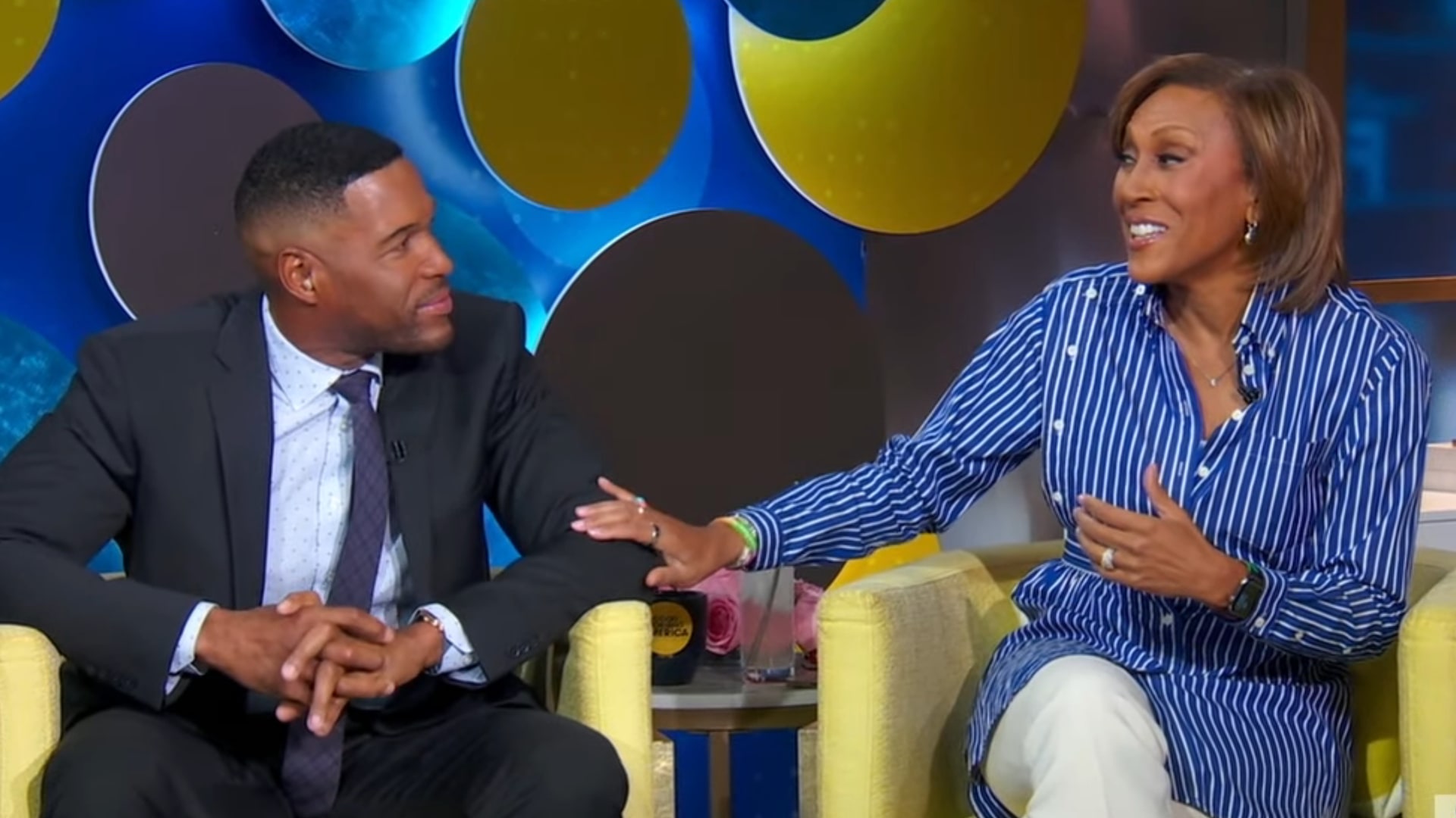 Michael Strahan makes emotional return to GMA as co-anchors show support