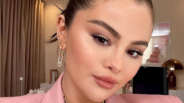 Selena Gomez poses in a full face of Rare Beauty 