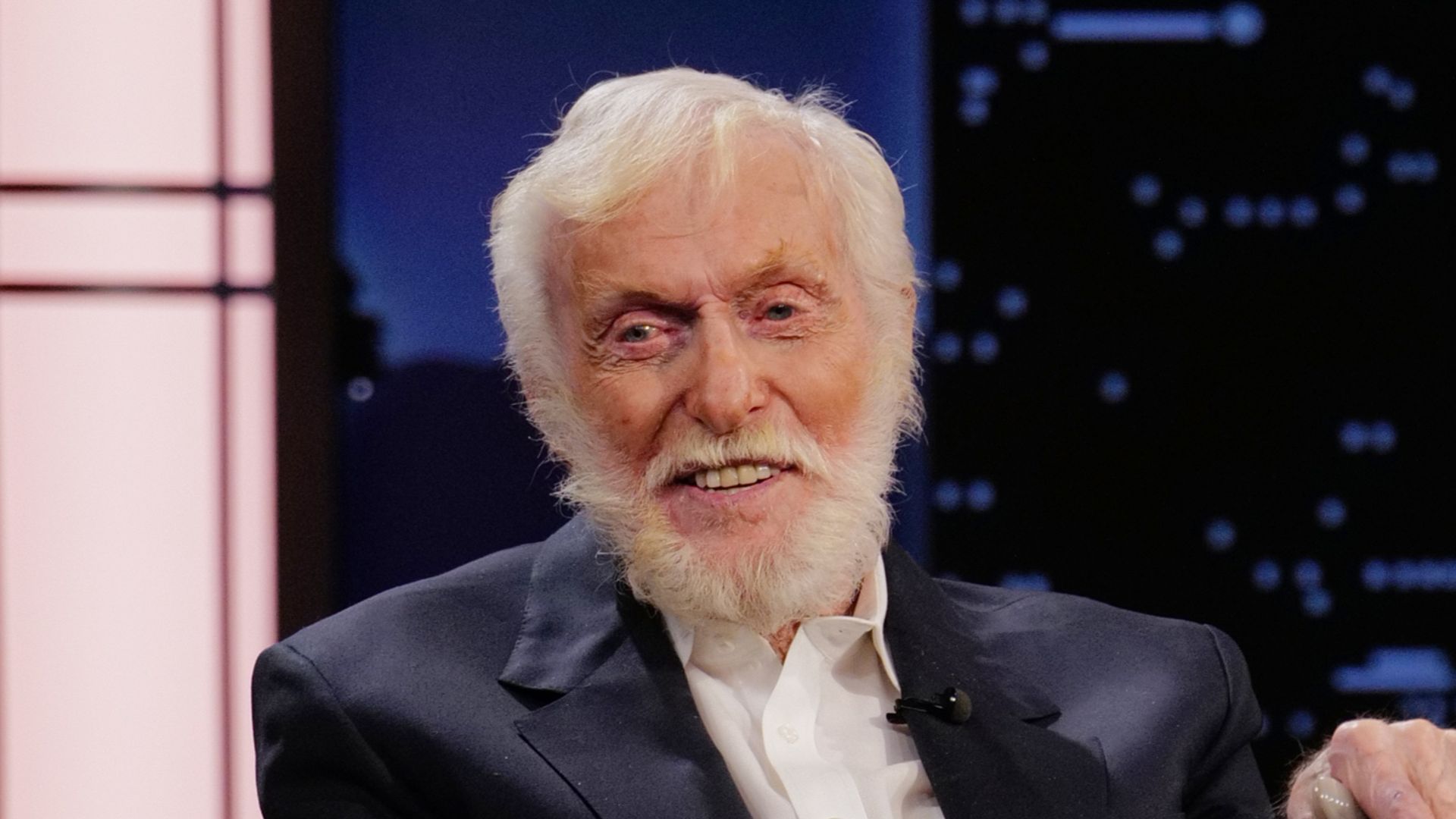 Dick Van Dyke with cane sitting in chair