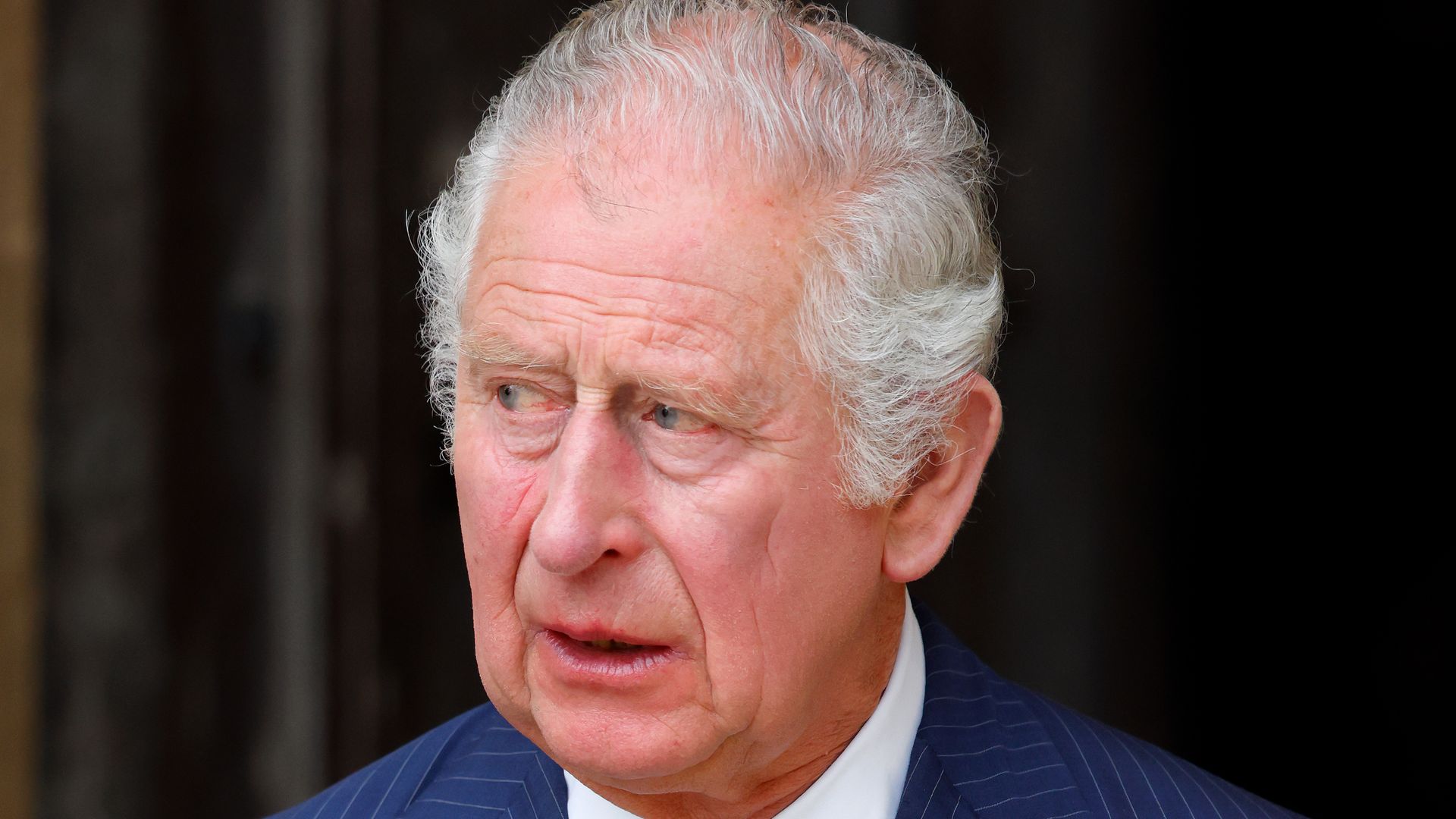 king charles in navy suit 