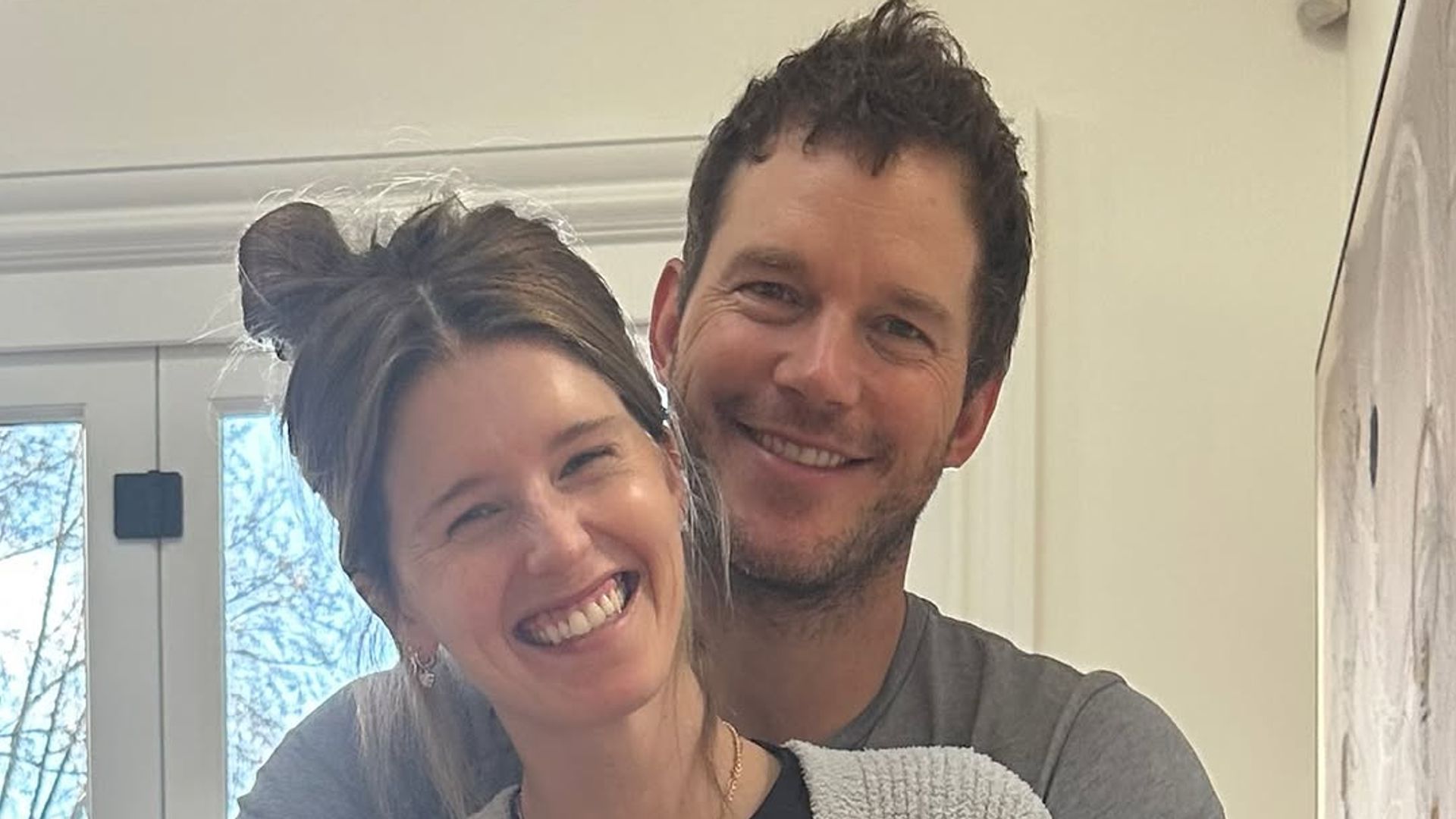 Chris Pratt puts his arms around wife Katherine Schwarzenegger as they pose for photo