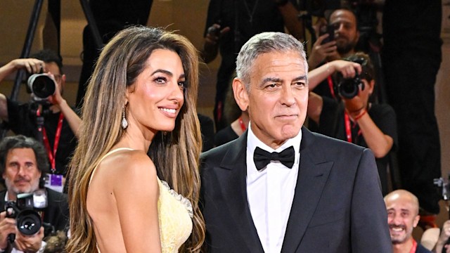 Amal Clooney and George Clooney attend the "Wolfs" red carpet during the 81st Venice International Film Festival