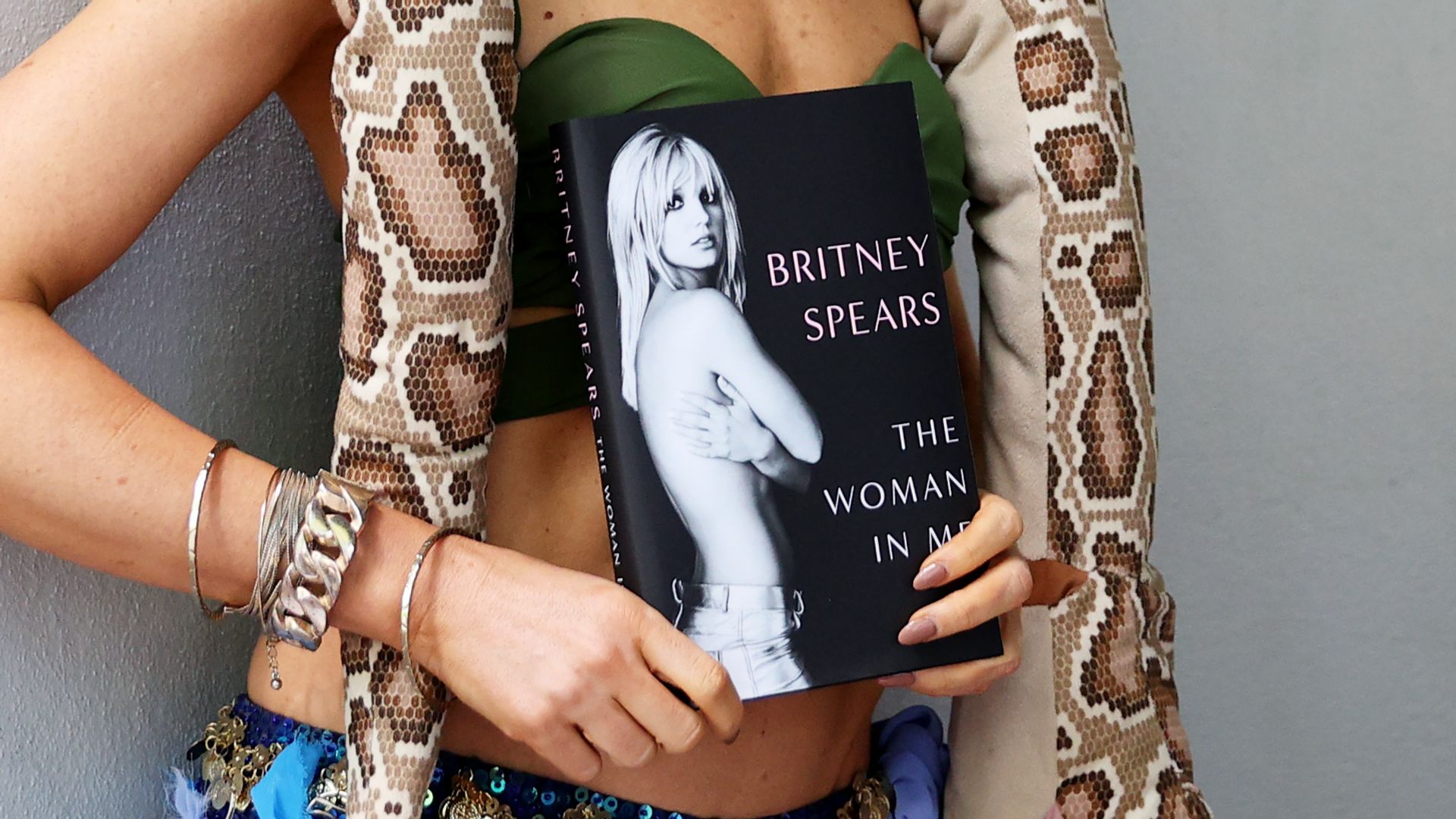 Britney Spears impersonator Sarah Brown poses with a copy of Britney's memoir 