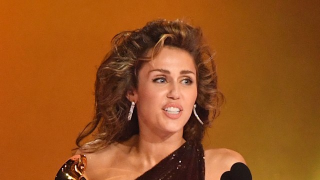 US singer-songwriter Miley Cyrus accepts the Record Of The Year award for "Flowers" on stage during the 66th Annual Grammy Awards at the Crypto.com Arena in Los Angeles on February 4, 2024. (Photo by Valerie Macon / AFP) (Photo by VALERIE MACON/AFP via Getty Images)