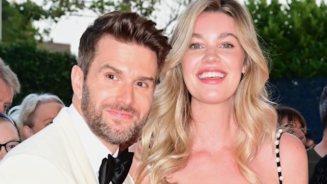 Joel Dommett cradling his wife Hannah's bump on the red carpet