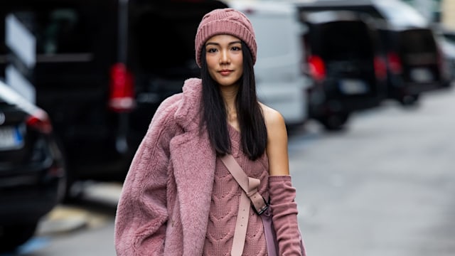 Yoyo Cao wears lavender knit dress, teddy coat, beanie outside Max Mara during the Milan Fashion Week - Womenswear Spring/Summer 2024 on September 21, 2023 in Milan, Italy. (Photo by Christian Vierig/Getty Images)