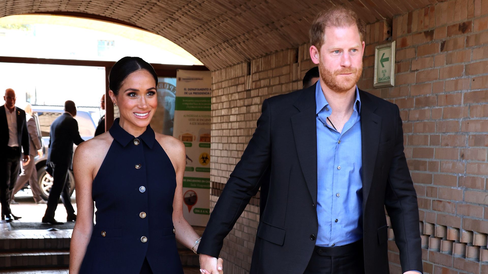 Prince Harry tenderly kisses wife Meghan in off-guard moment