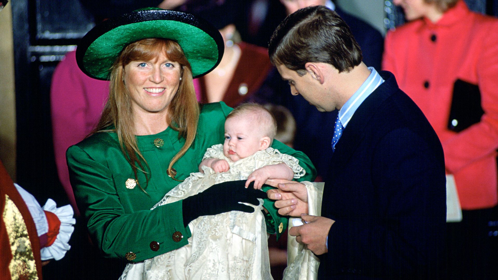 Sarah Ferguson hold a baby Princess Beatrice at a christening