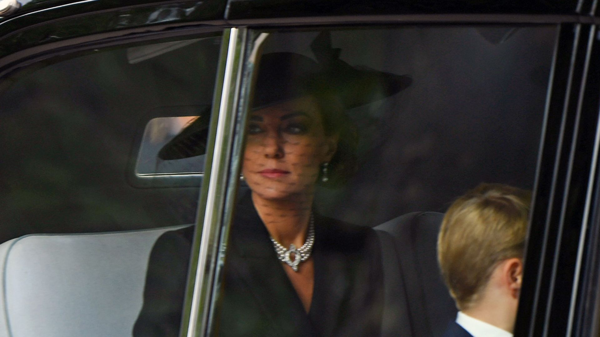 kate middleton wears hat queens funeral