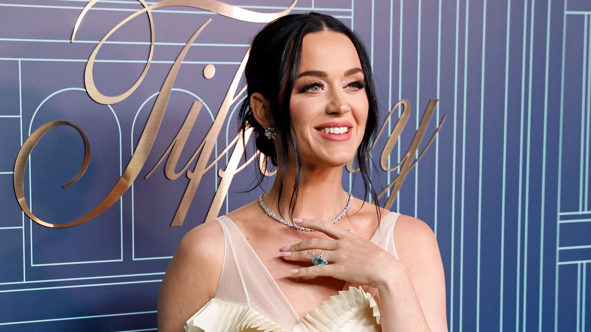 Katy Perry smiling and looking to the left