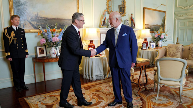 King Charles III welcomes Sir Keir Starmer during an audience at Buckingham Palace, London, where he invited the leader of the Labour Party to become Prime Minister 