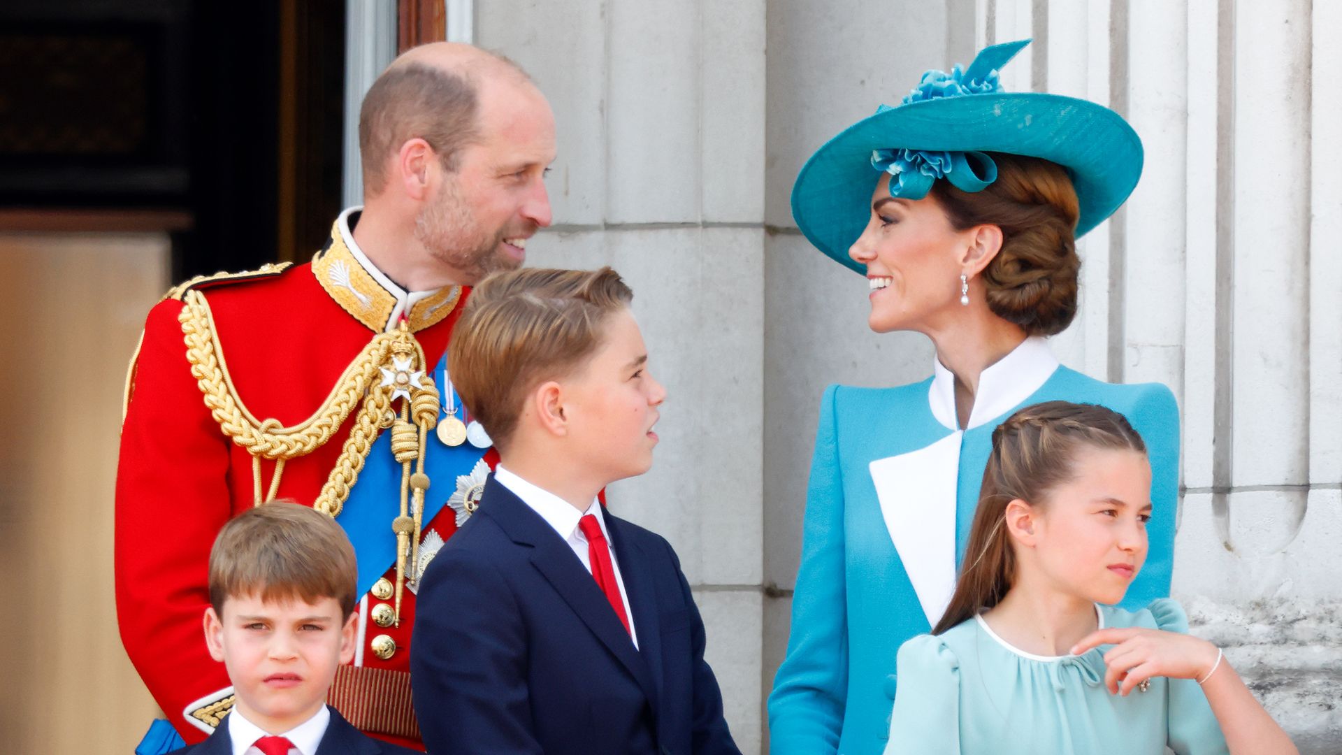 Prince William, Prince Louis, Prince George, the Princess of Wales and Princess Charlotte watch an RAF flypast from the balcony of Buckingham Palace