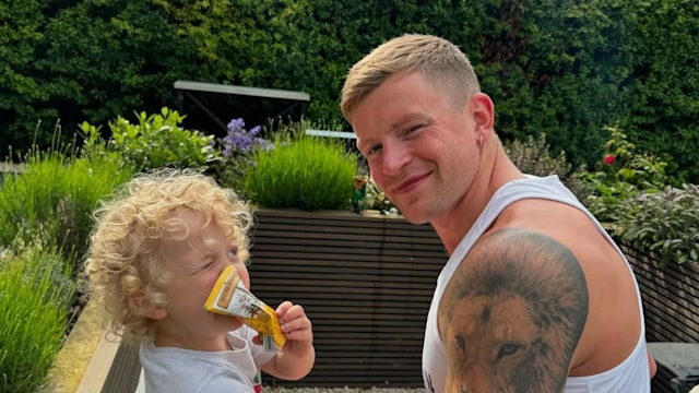 Adam Peaty with his son George