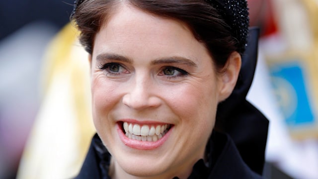 woman smiling in black headband 