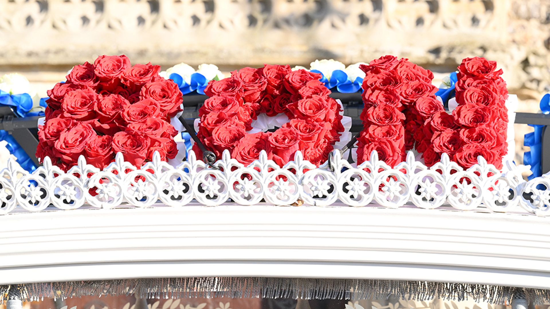 A floral tribute on the hearse which spells the word 'Son' 