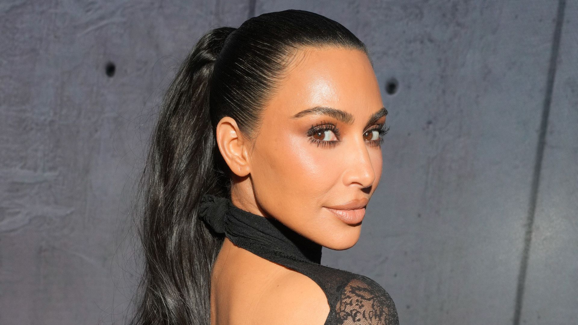 Kim Kardashian Embodies Romance in a Lace Gown at Balenciaga Show