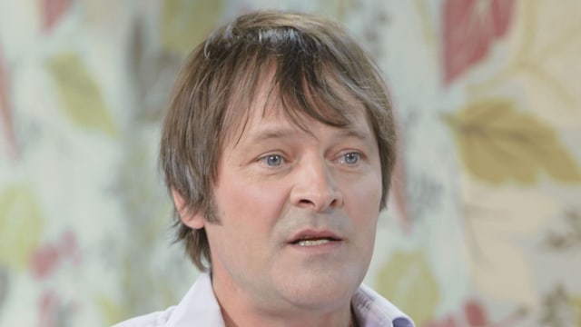 Mark Heap in a white shirt 