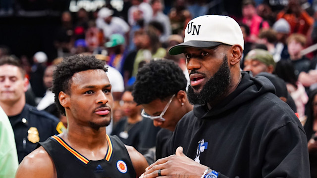 Bronny James #6 of the West team talks to Lebron James of the Los Angeles Lakers after the 2023 McDonald's High School Boys All-American Game at Toyota Center on March 28, 2023 in Houston, Texas