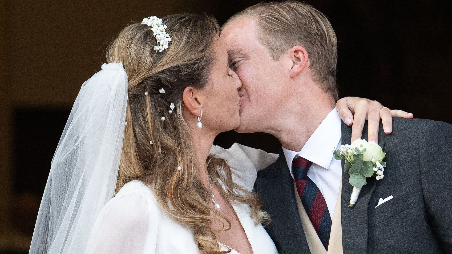 Archduke Alexander of Habsburg-Lorraine kissing Countess Natacha Roumiantzoff-Pachkevitch following their wedding ceremony