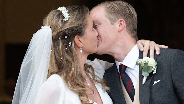 Archduke Alexander of Habsburg-Lorraine kissing Countess Natacha Roumiantzoff-Pachkevitch following their wedding ceremony