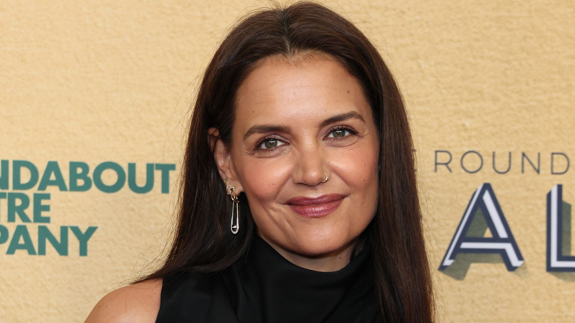 Katie Holmes stuns in body-skimming dress in first appearance since 'false' Tom Cruise reports