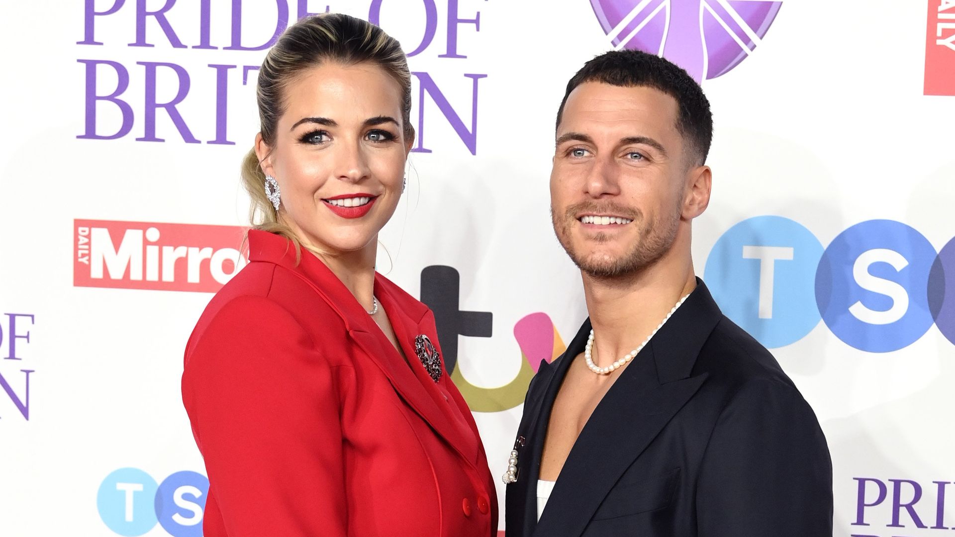 Gemma Atkinson in red suit with Gorka Marquez in black suit