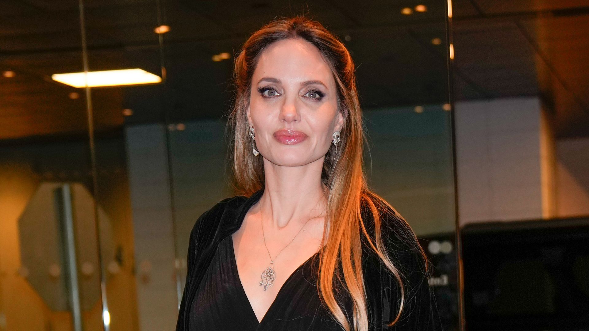 Angelina Jolie’s ethereal dress and coat combo is peak winter chic