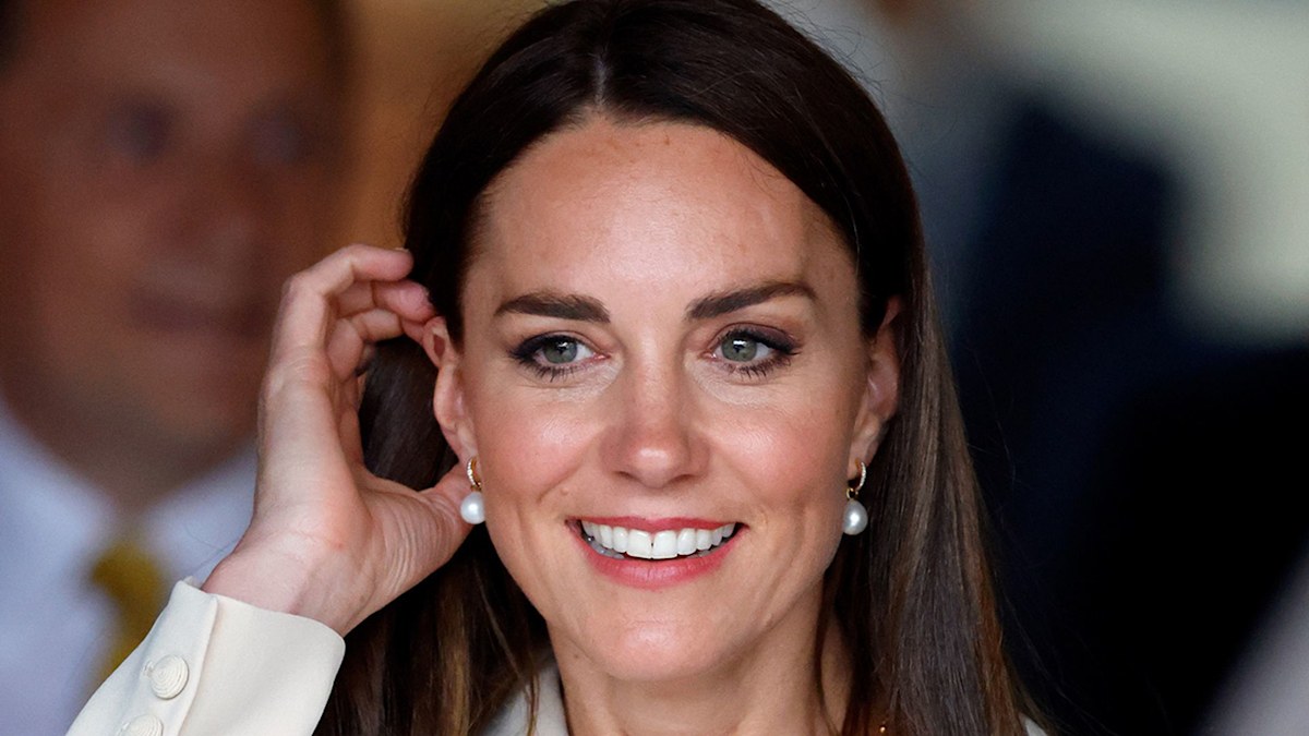 Kate Middleton stuns in £750 printed coat during incredibly moving ...