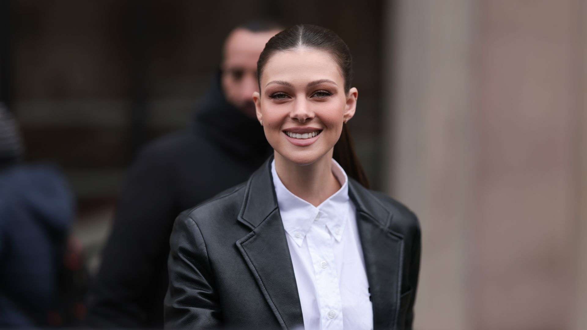PARIS, FRANCE - MARCH 07: Nicola Peltz seen wearing a black leather jacket and a white blouse before the Miu Miu show on March 07, 2023 in Paris, France. (Photo by Jeremy Moeller/Getty Images)