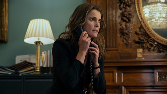 Keri Russell as Kate Wyler takes phone call in episode four