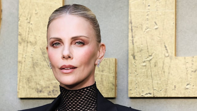 Charlize oozed confidence in her fishnet catsuit