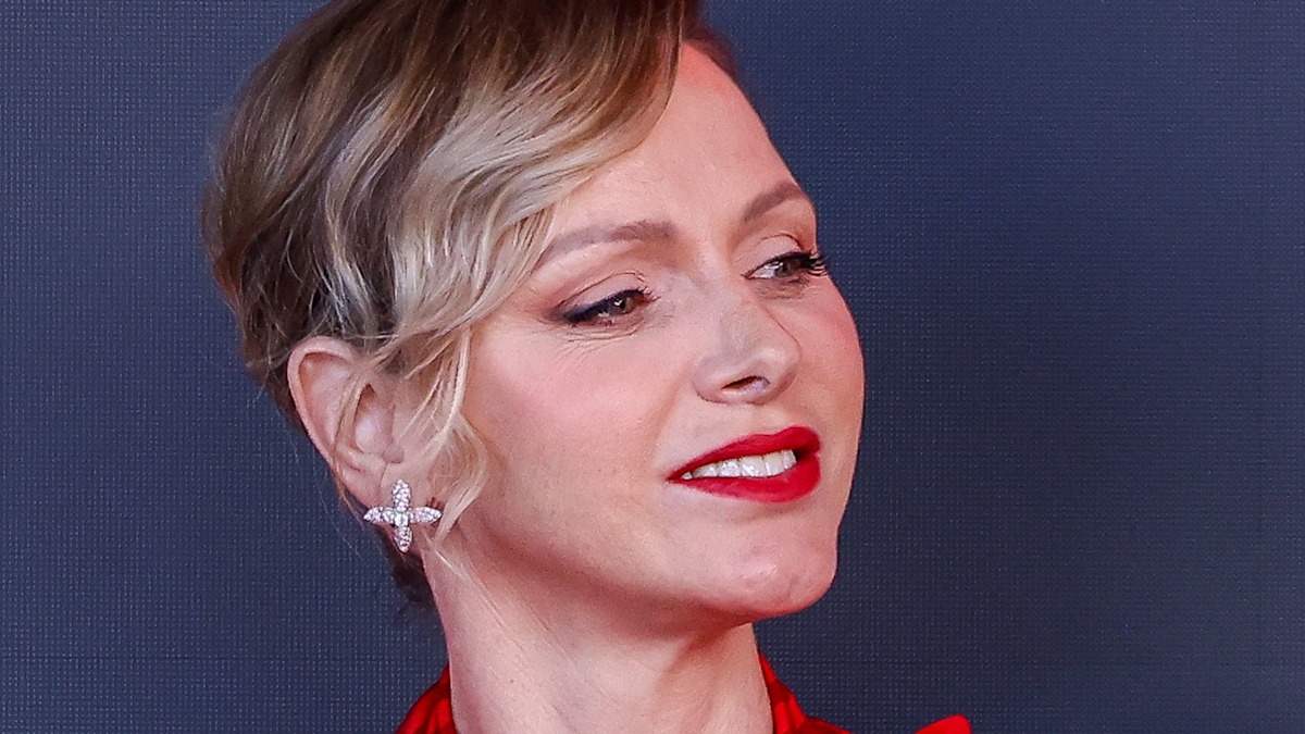 Princess Charlene is a scarlet siren in gorgeous form-fitting gown
