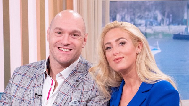 Paris and Tyson Fury smiling on sofa