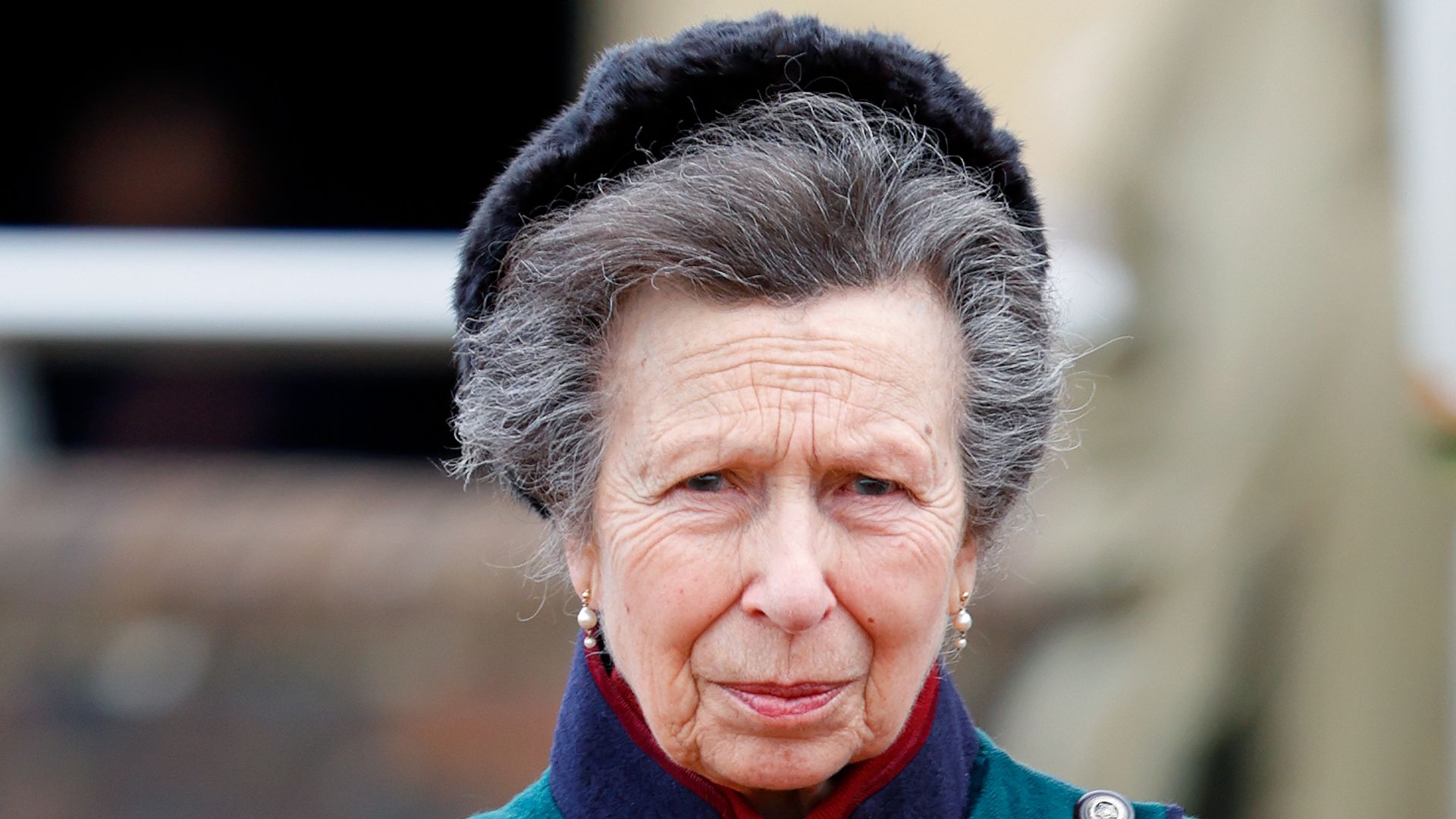 Princess Anne in long teal coat and boots
