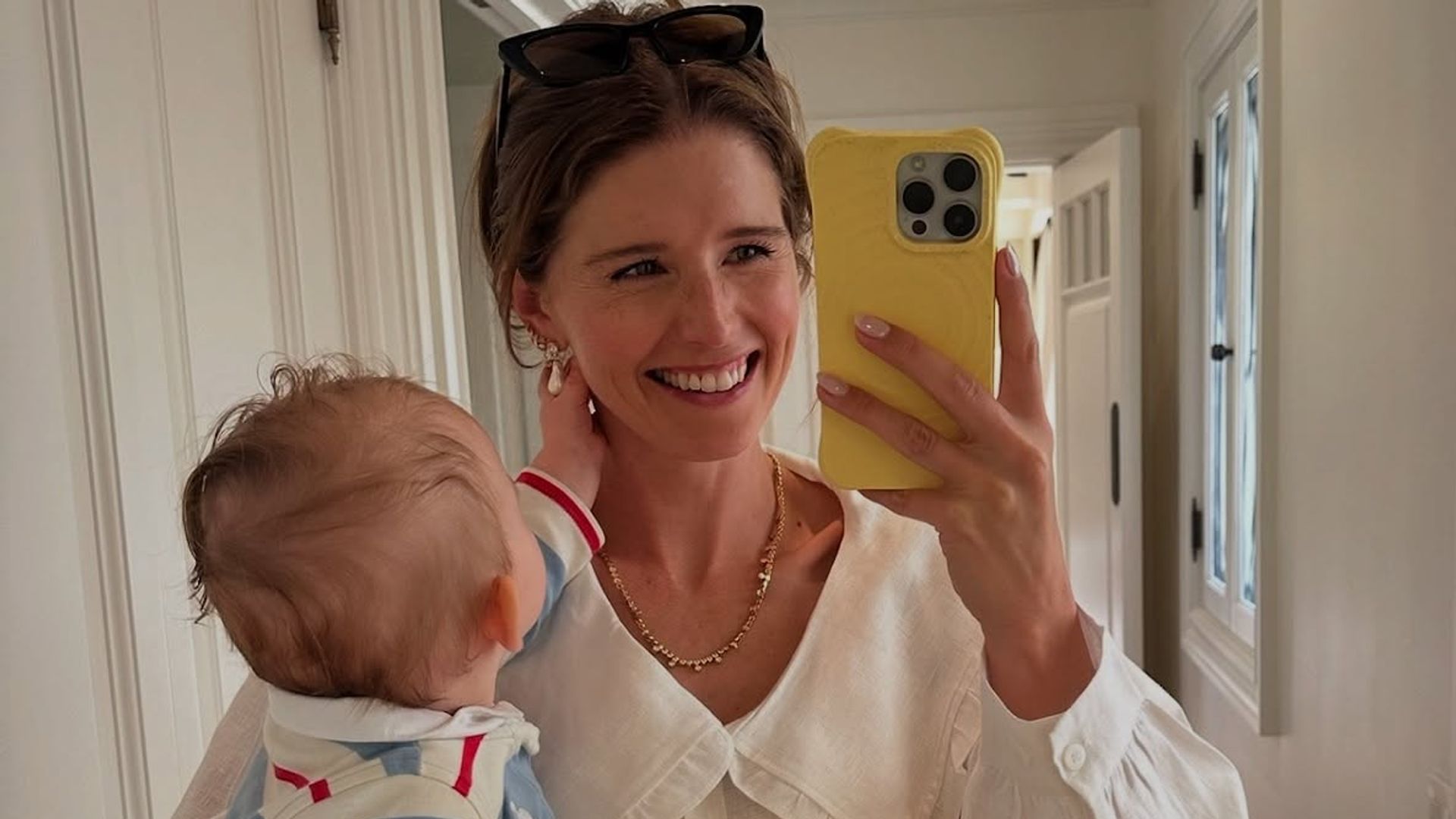photo of katherine schwarzenegger holding son ford
