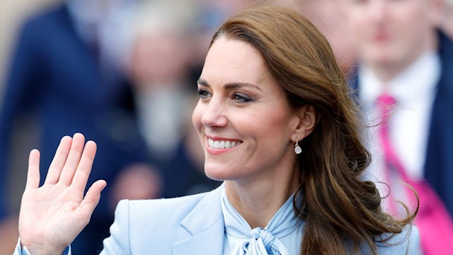 Catherine, Princess of Wales waves in pale blue shirt and coat