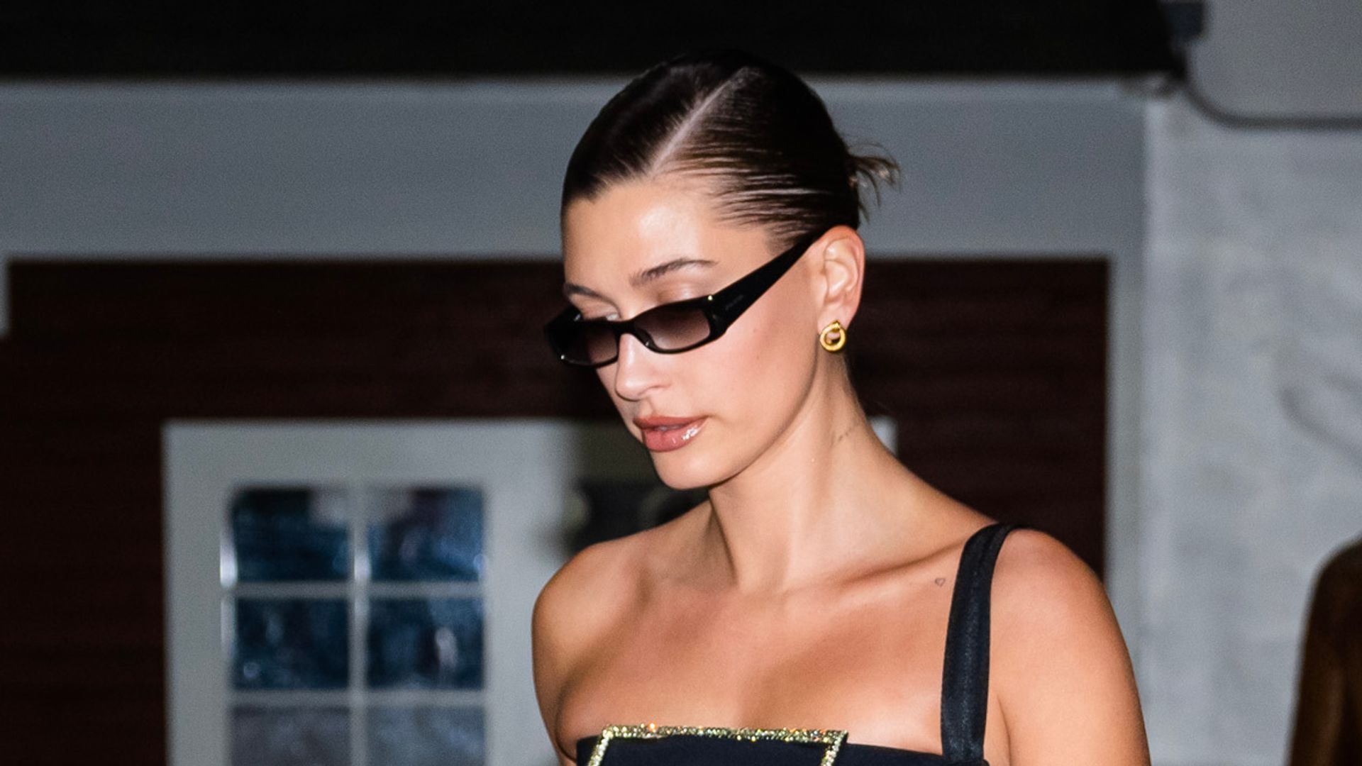 Hailey Bieber teamed her minimalist manicure with a classic little black dress 